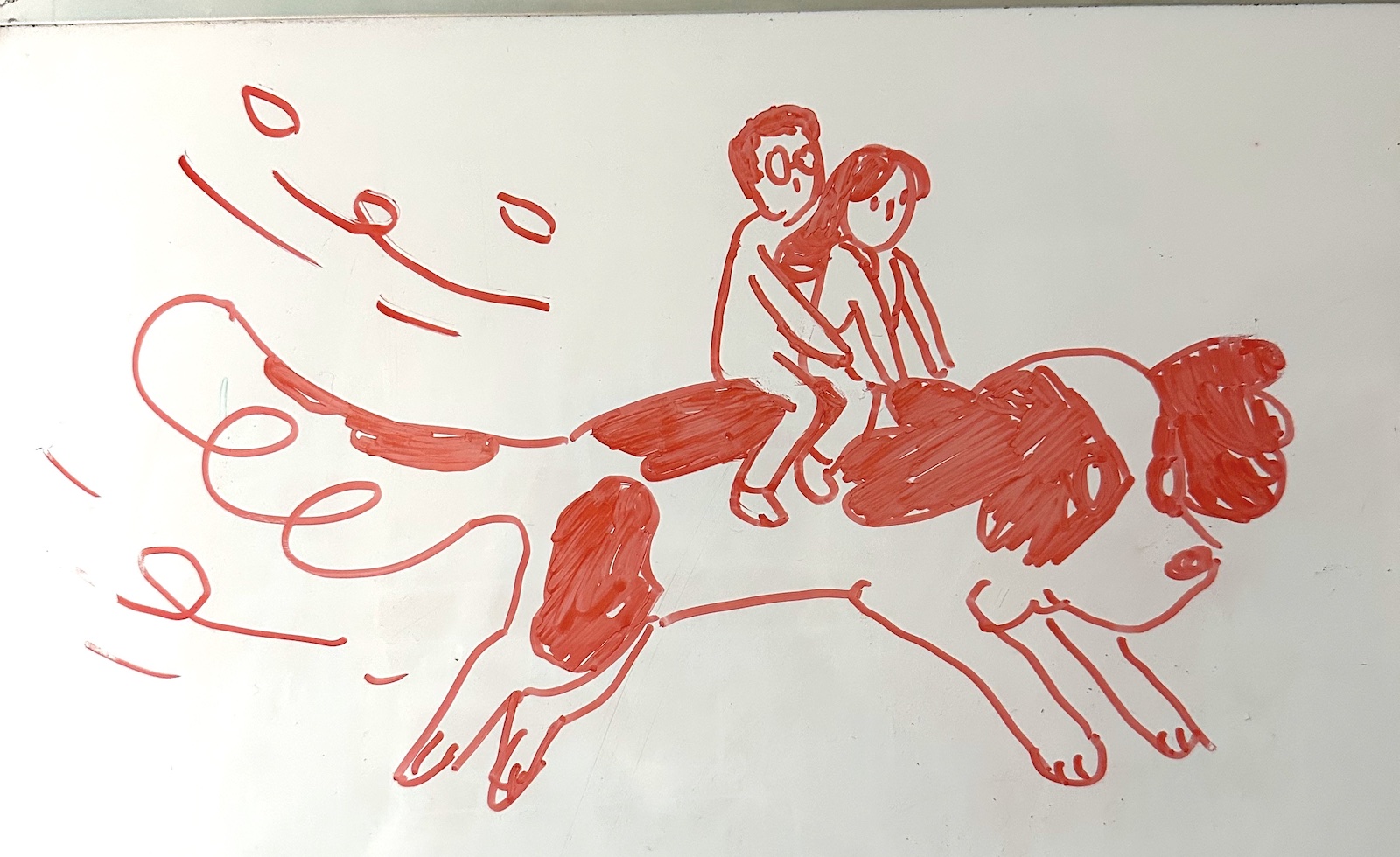An illustration on a whiteboard that shows my wife and I riding on top of our dog, Rolo. It's not really related to this article, but I liked it so I included it